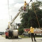 Harris-McBurney installing Cable TV overlead coax