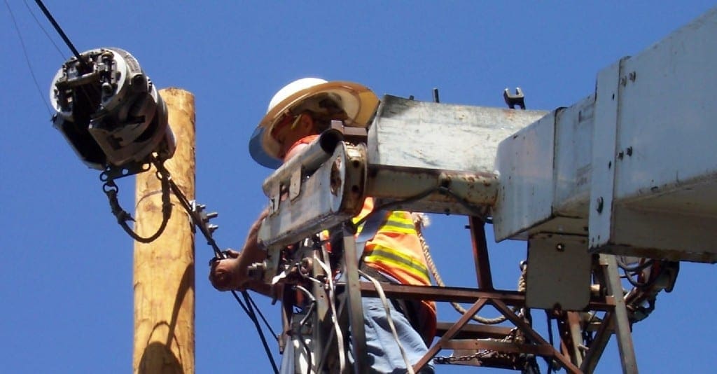 Harris-McBurney linemen working installing a pwer line